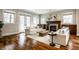 Inviting living room featuring a fireplace, hardwood floors, and stylish decor at 768 Trailside Dr, Carmel, IN 46032
