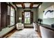 Stylish home office with coffered ceilings, lots of natural light and an executive desk at 768 Trailside Dr, Carmel, IN 46032