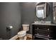 Stylish powder room with modern fixtures, a vessel sink, and an elegant vanity offering space and comfort at 768 Trailside Dr, Carmel, IN 46032