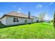A large, well-maintained backyard with lush green grass and a sliding door entrance at 7854 Crooked Meadows Dr, Indianapolis, IN 46268