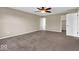 Spacious bedroom featuring neutral paint and carpet, plus a ceiling fan for added comfort at 7854 Crooked Meadows Dr, Indianapolis, IN 46268