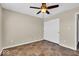 Comfortable bedroom featuring a ceiling fan, tiled floor, and closet at 7854 Crooked Meadows Dr, Indianapolis, IN 46268