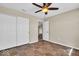Simple bedroom with tiled floor, ceiling fan and a closet for storage at 7854 Crooked Meadows Dr, Indianapolis, IN 46268