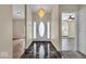 Inviting foyer features marble tile flooring, chandelier, and views into other rooms at 7854 Crooked Meadows Dr, Indianapolis, IN 46268