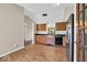 Spacious kitchen featuring ample counter space, stainless steel refrigerator, and warm lighting at 7854 Crooked Meadows Dr, Indianapolis, IN 46268