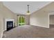 Spacious living room features carpet and a fireplace, with sliding glass doors to the backyard at 7854 Crooked Meadows Dr, Indianapolis, IN 46268