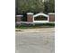 Community sign with brick pillars, landscaping, and black and gold lettering at 7916 Begonia Ct, Indianapolis, IN 46113