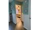 Hallway with view into bedroom featuring ceiling fan and natural light at 7916 Begonia Ct, Indianapolis, IN 46113