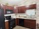 Well-equipped kitchen featuring stainless steel appliances, granite countertops, and ample cabinet space at 7916 Begonia Ct, Indianapolis, IN 46113