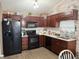 Functional kitchen boasts modern appliances, granite countertops, and plenty of storage for cooking enthusiasts at 7916 Begonia Ct, Indianapolis, IN 46113
