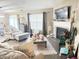 Inviting living room with fireplace, natural light and comfortable seating, creating a welcoming ambiance at 7916 Begonia Ct, Indianapolis, IN 46113