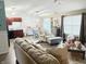 Open-concept living room and dining area with abundant seating and natural light is great for entertaining at 7916 Begonia Ct, Indianapolis, IN 46113