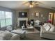 Cozy living room with fireplace and vaulted ceilings offers an inviting space for relaxation at 7916 Begonia Ct, Indianapolis, IN 46113