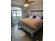 Bedroom with cozy rug, natural light, and stylish bed at 7916 Begonia Ct, Indianapolis, IN 46113