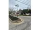 Community entrance on a corner with a street sign, green lawn, and decorative sign at 7916 Begonia Ct, Indianapolis, IN 46113
