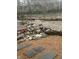 Picturesque backyard retreat with custom rock features, zen gravel, and mature trees at 8224 Claridge Rd, Indianapolis, IN 46260