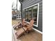 Relaxing backyard features a deck, comfortable seating, and beautiful windows at 8224 Claridge Rd, Indianapolis, IN 46260