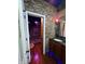 Unique bathroom with brick accent wall, wooden cabinets, and a view of a spa shower at 8224 Claridge Rd, Indianapolis, IN 46260
