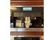 Built-in Miele coffee station with espresso machine and integrated controls for easy beverage preparation at 8224 Claridge Rd, Indianapolis, IN 46260