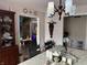Charming dining room with elegant decor, stylish lighting, and a view into the adjacent living areas at 8224 Claridge Rd, Indianapolis, IN 46260