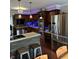 Modern kitchen with stainless steel appliances, custom cabinetry, and a functional island with seating at 8224 Claridge Rd, Indianapolis, IN 46260