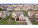 Aerial shot of property in a scenic neighborhood, highlighting a beautifully landscaped yard at 9880 Wading Crane Ave, Fishers, IN 46055