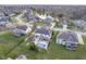 Picturesque aerial view of a home with a backyard pool surrounded by a well-manicured lawn at 9880 Wading Crane Ave, Fishers, IN 46055