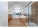 Bright bathroom with soaking tub, glass shower, and tile flooring at 9880 Wading Crane Ave, Fishers, IN 46055