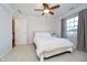 Comfortable bedroom with ceiling fan, bed, and window at 9880 Wading Crane Ave, Fishers, IN 46055
