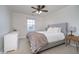 Comfortable bedroom with ceiling fan, bed, and natural light at 9880 Wading Crane Ave, Fishers, IN 46055