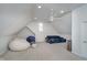 Spacious bonus room with vaulted ceilings, and casual seating at 9880 Wading Crane Ave, Fishers, IN 46055