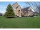 Handsome brick residence has classic architectural features, professional landscaping, and curb appeal at 9880 Wading Crane Ave, Fishers, IN 46055