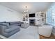 Inviting living room with a fireplace, built-in shelving, and comfortable seating for relaxation at 9880 Wading Crane Ave, Fishers, IN 46055