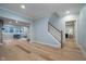 Elegant living room with hardwood floors leads to a bedroom and a well-lit seating area at 9880 Wading Crane Ave, Fishers, IN 46055