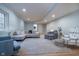 Bright, spacious living room features stylish furniture, neutral tones and ample natural light at 9880 Wading Crane Ave, Fishers, IN 46055