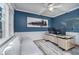 Stylish home office featuring blue walls, ample natural light, and modern furnishings at 9880 Wading Crane Ave, Fishers, IN 46055