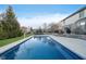 Stunning pool and backyard area with a basketball court, BBQ, and outdoor furniture at 9880 Wading Crane Ave, Fishers, IN 46055