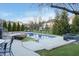 Inviting backyard features a refreshing pool, fire pit, and outdoor seating for relaxation at 9880 Wading Crane Ave, Fishers, IN 46055