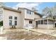 Spacious backyard and home exterior featuring a large, weathered wooden deck at 10516 Beacon Ln, Indianapolis, IN 46256