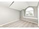 Bright bedroom featuring arched window and neutral walls at 10516 Beacon Ln, Indianapolis, IN 46256