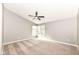 Bright bedroom featuring a ceiling fan and a window for natural light at 10516 Beacon Ln, Indianapolis, IN 46256