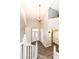 Inviting foyer with hardwood floors, pendant lighting, and staircase to the second floor at 10516 Beacon Ln, Indianapolis, IN 46256