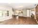 Bright, open living room showcasing hardwood floors and view into eat-in kitchen at 10516 Beacon Ln, Indianapolis, IN 46256