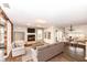 A furnished living room with a fireplace, hardwood floors and sliding glass doors at 10516 Beacon Ln, Indianapolis, IN 46256