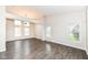 Bright and airy living room showcasing hardwood floors, and abundant natural light at 10516 Beacon Ln, Indianapolis, IN 46256