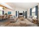 A welcoming living room showcasing hardwood floors, comfortable seating, and natural lighting at 10516 Beacon Ln, Indianapolis, IN 46256