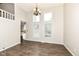 Bright living room with hardwood floors and a dining area view, flooded with natural light at 10516 Beacon Ln, Indianapolis, IN 46256