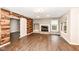 Bright living room features wood floors, a fireplace, and barn door accent wall at 10516 Beacon Ln, Indianapolis, IN 46256