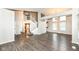 A sprawling living space featuring hardwood floors, a staircase, and a cozy atmosphere at 10516 Beacon Ln, Indianapolis, IN 46256
