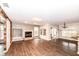 Bright open living room features a fireplace, hardwood floors and sliding glass doors at 10516 Beacon Ln, Indianapolis, IN 46256